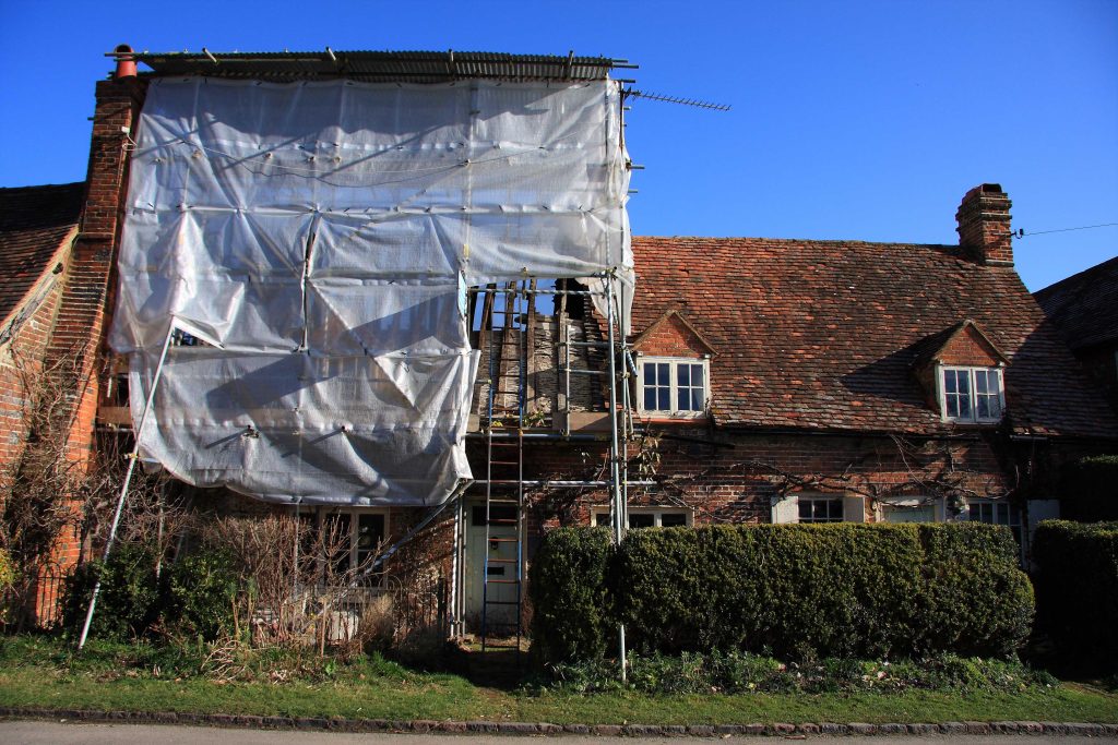 Fire damage effects part of the structure of this brick  home.